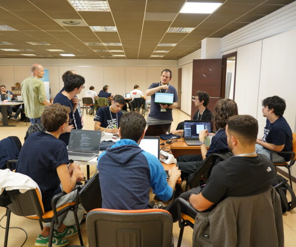 Teams and mentors hard at work during the Hackathon
