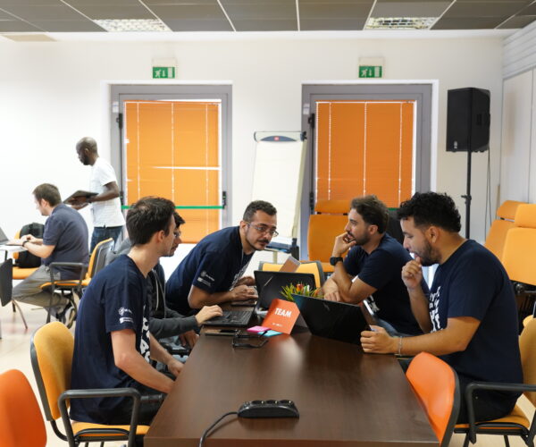 Teams and mentors at work during the Hackathon