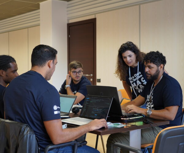 Teams and mentors at work during the Hackathon